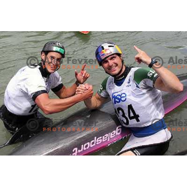 Jure Meglic (second place) and winner Peter Kauzer of Slovenia celebrate after ICF Canoe Slalom World Cup race SLOKA 2011 in Tacen, Ljubljana, Slovenia on June 25,2011 