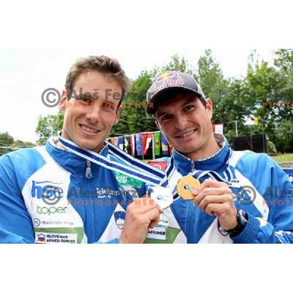Jure Meglic (second place) and winner Peter Kauzer of Slovenia celebrate after ICF Canoe Slalom World Cup race SLOKA 2011 in Tacen, Ljubljana, Slovenia on June 25,2011 