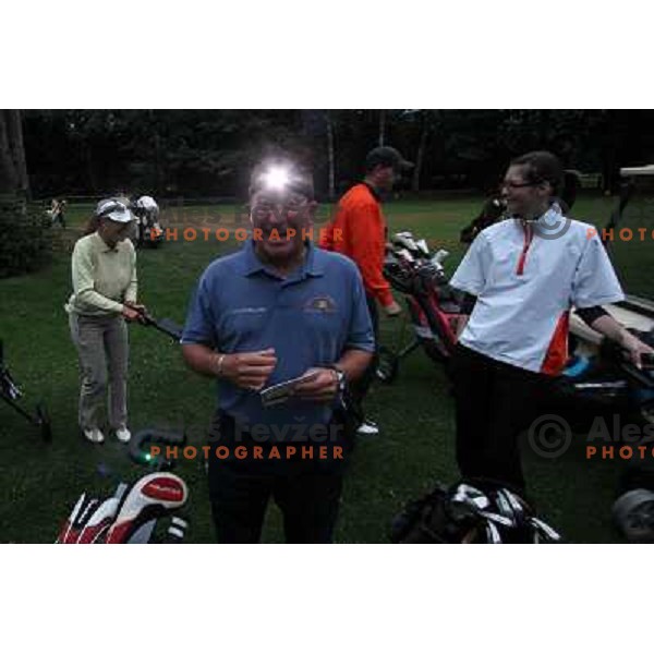 Night golf tournament with glowing golf balls at King\'s golf course at Bled, Slovenia on July 15, 2011 