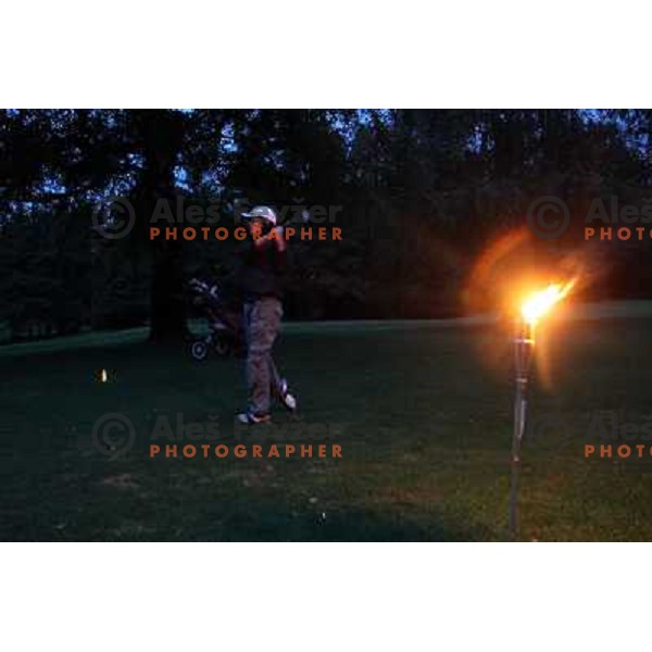 Night golf tournament with glowing golf balls at King\'s golf course at Bled, Slovenia on July 15, 2011 