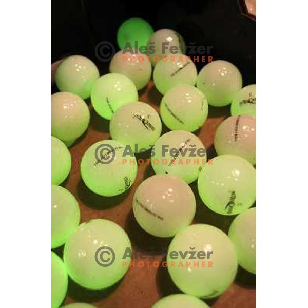 Night golf tournament with glowing golf balls at King\'s golf course at Bled, Slovenia on July 15, 2011 
