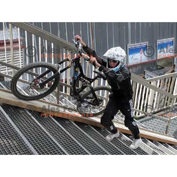 Little french kid waiting for the gondola DMC 1 (1850- 2100 meters) in MTB park in Alpe d\'Huez ski resort, France on August 3, 2011 
