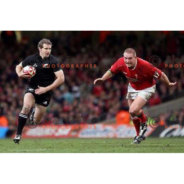 Nick Evans drives past Gethin Jenkins at rugby match between Wales and New Zealand at Millennium Stadium, Cardiff, Wales on November 25, 2006. New Zealand won 45:10