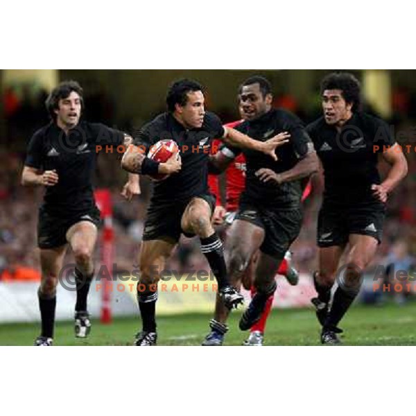 Conrad Smith,Rico Gear ( with the ball) Sitiveni Sivivatu and Mils Muliaina (left to right) running at rugby match between Wales and New Zealand at Millennium Stadium, Cardiff, Wales on November 25, 2006. New Zealand won 45:10