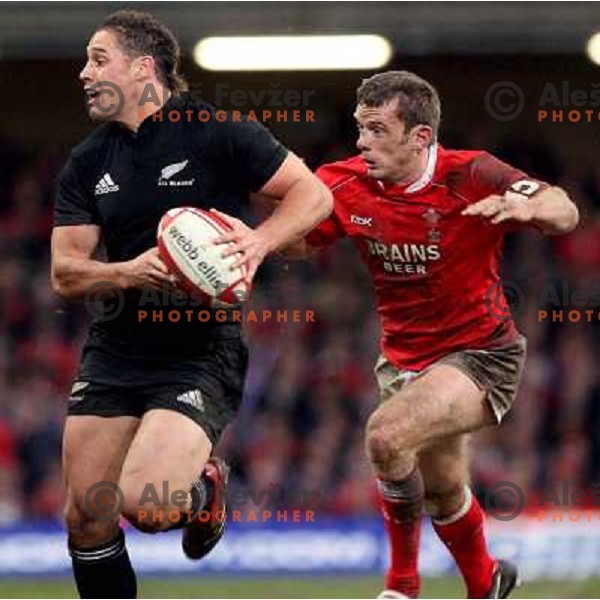 McAllister drives past Kevin Morgan at rugby match between Wales and New Zealand at Millennium Stadium, Cardiff, Wales on November 25, 2006. New Zealand won 45:10