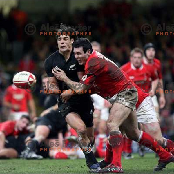 Stephen Jones tries to stop Dan Carter at rugby match between Wales and New Zealand at Millennium Stadium, Cardiff, Wales on November 25, 2006. New Zealand won 45:10
