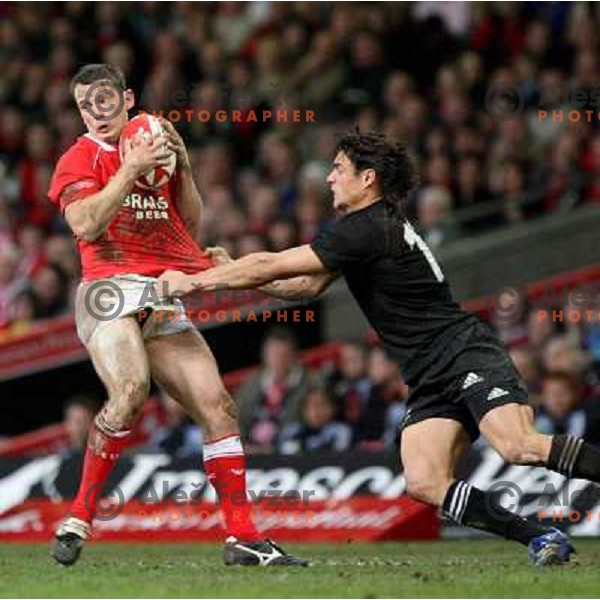 Dan Carter tries to stop Kevin Morgan at rugby match between Wales and New Zealand at Millennium Stadium, Cardiff, Wales on November 25, 2006. New Zealand won 45:10