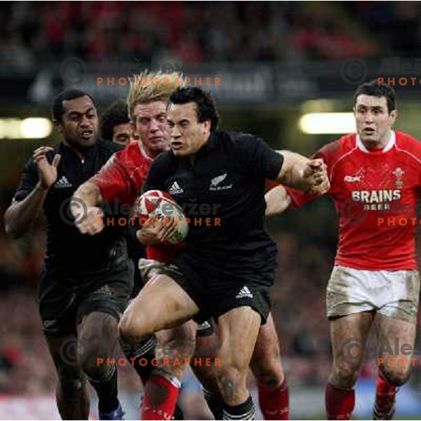 Alix Pophan chasing Rico Gear with the ball at rugby match between Wales and New Zealand at Millennium Stadium, Cardiff, Wales on November 25, 2006. New Zealand won 45:10