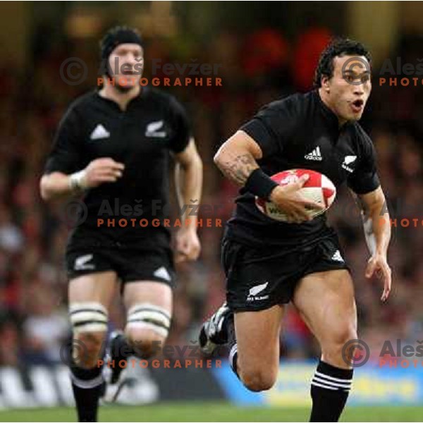 Rico Gear running with the ball at rugby match between Wales and New Zealand at Millennium Stadium, Cardiff, Wales on November 25, 2006. New Zealand won 45:10