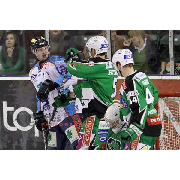 Marton Vas of Sapa Fehervar AV 19 and Scott Hotham of Tilia Olimpija in action during EBEL league regular season game in round 27 between Tilia Olimpija and Sapa Fehervar AV 19 in Hala Tivoli, Ljubljana, Slovenia on December 2, 2011 