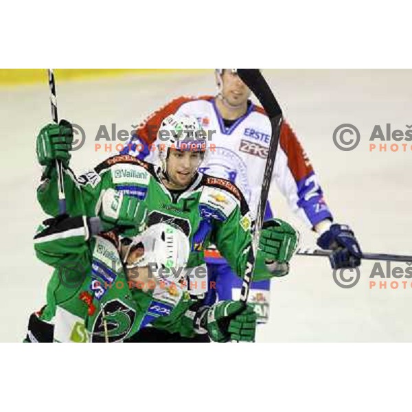 Matej Hocevar, Ziga Pance of Tilia Olimpija celebrate goal during EBEL league regular season ice-hockey match in round 30 between HDD Tilia Olimpija Ljulbjana and KHL Medvescak Zagreb in Hala Tivoli, Ljubljana, Slovenia on December 9, 2011 