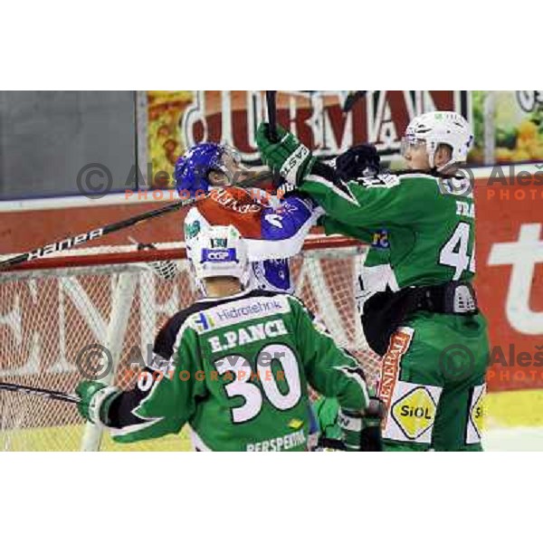 David Brine of Medvescak and Jamie Fraser of Tilia Olimpija in action during EBEL league regular season ice-hockey match in round 30 between HDD Tilia Olimpija Ljulbjana and KHL Medvescak Zagreb in Hala Tivoli, Ljubljana, Slovenia on December 9, 2011 