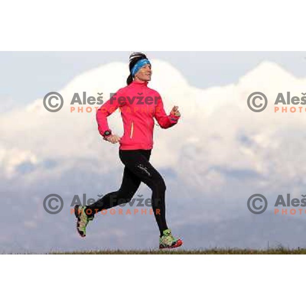 Anica Zivko of Slovenia, mountain runner from Celje during practice session with new Garmin Forerunner 610 in the hills near Kranj, Slovenia on December 6, 2011 