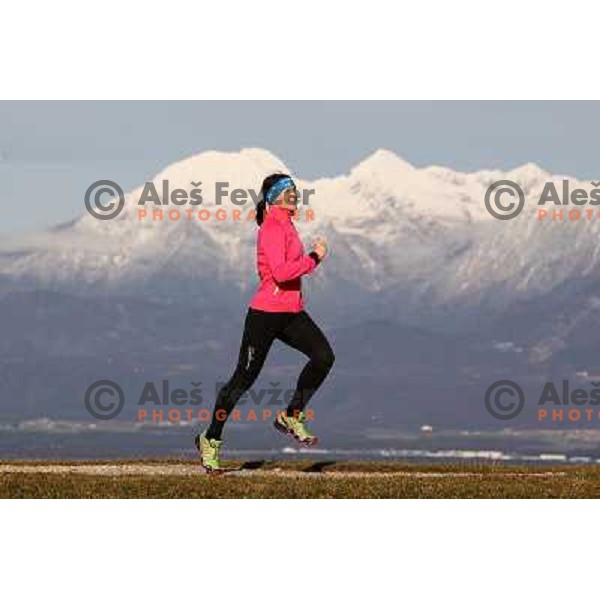 Anica Zivko of Slovenia, mountain runner from Celje during practice session with new Garmin Forerunner 610 in the hills near Kranj, Slovenia on December 6, 2011 