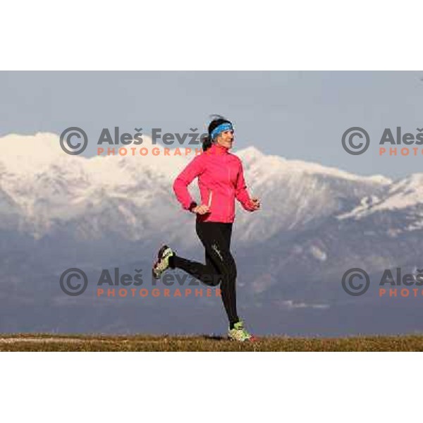 Anica Zivko of Slovenia, mountain runner from Celje during practice session with new Garmin Forerunner 610 in the hills near Kranj, Slovenia on December 6, 2011 