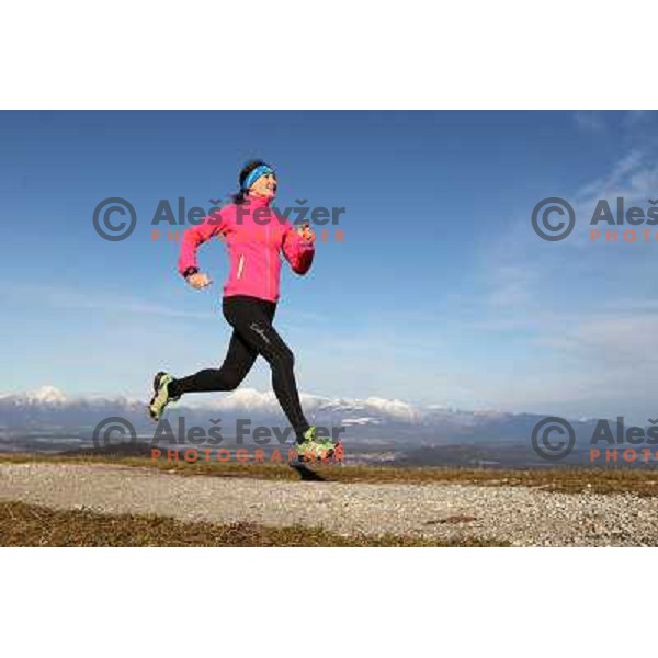Anica Zivko of Slovenia, mountain runner from Celje during practice session with new Garmin Forerunner 610 in the hills near Kranj, Slovenia on December 6, 2011 