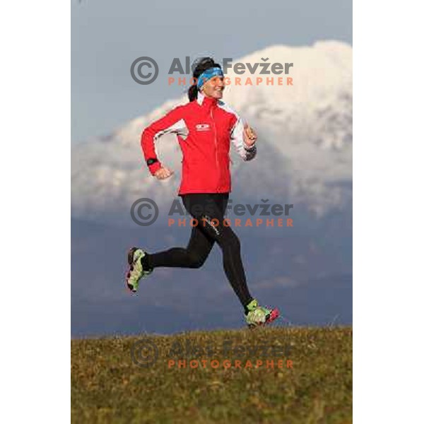 Anica Zivko of Slovenia, mountain runner from Celje during practice session with new Garmin Forerunner 610 in the hills near Kranj, Slovenia on December 6, 2011 