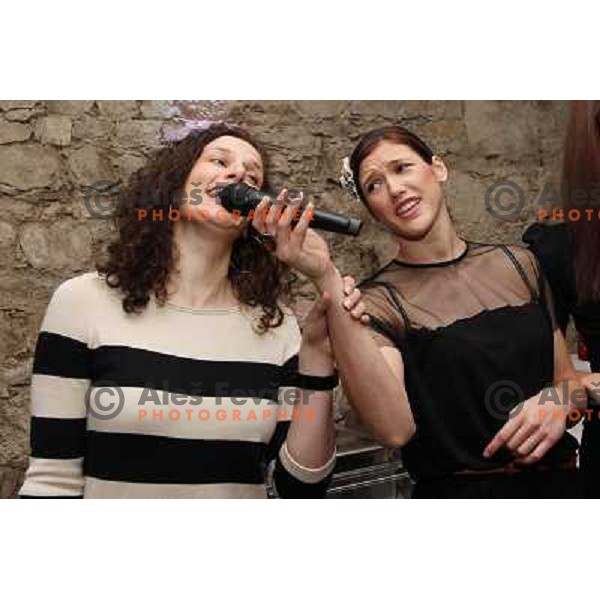 Kristina Franic and Jelena Grubisic of handball club Krim Mercator enjoy during Chrismas party in Goodlife Club at Ljubljana Castle, Slovenia on December 22, 2011 