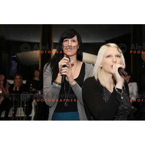 Alja Koren and Tamara Mavsar of handball club Krim Mercator enjoy during Chrismas party in Goodlife Club at Ljubljana Castle, Slovenia on December 22, 2011 