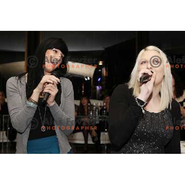 Alja Koren and Tamara Mavsar of handball club Krim Mercator enjoy during Chrismas party in Goodlife Club at Ljubljana Castle, Slovenia on December 22, 2011 