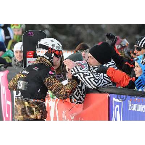 Rok Flander of Slovenia (left) took third place during LG Snowboard FIS World Cup Parallel Giant Slalom 2011-2012 in Carezza, Dolomites, Italy on December 21, 2011 