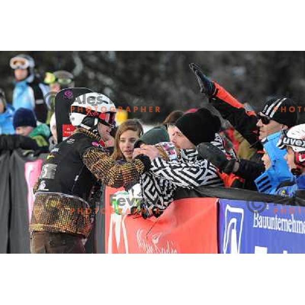 Rok Flander of Slovenia (left) took third place during LG Snowboard FIS World Cup Parallel Giant Slalom 2011-2012 in Carezza, Dolomites, Italy on December 21, 2011 