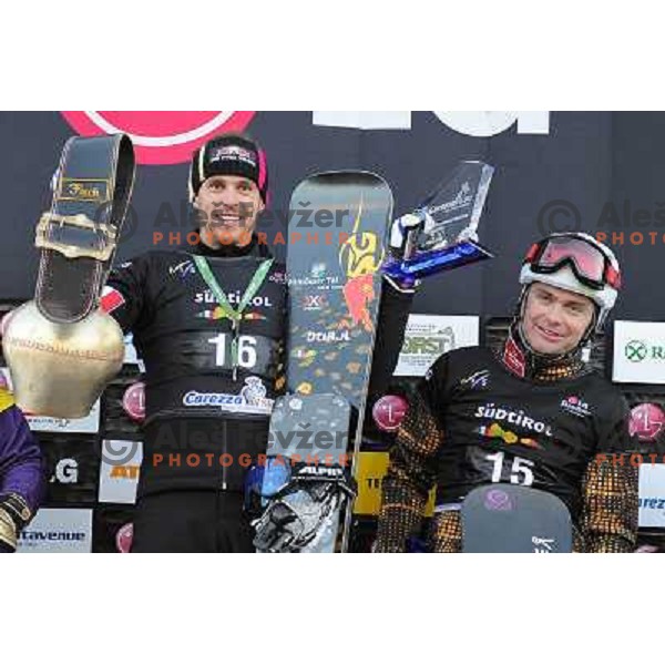 Rok Flander of Slovenia (right) took third place during LG Snowboard FIS World Cup Parallel Giant Slalom 2011-2012 in Carezza, Dolomites, Italy on December 21, 2011 