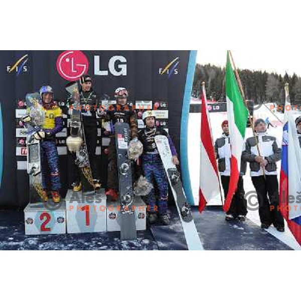 Rok Flander of Slovenia (right) took third place during LG Snowboard FIS World Cup Parallel Giant Slalom 2011-2012 in Carezza, Dolomites, Italy on December 21, 2011 