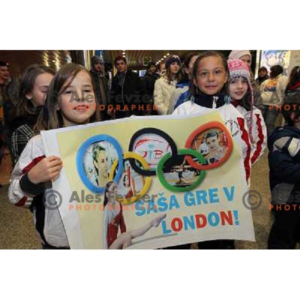 Slovenian gymnast Sasa Golob receives warm welcome from his friends and fans at Joze Pucnik Airport, Ljubljana, Slovenia on January 14, 2012 after success at Olympic qualification event for London 2012 Olympic games. She will be olympian for the first tim