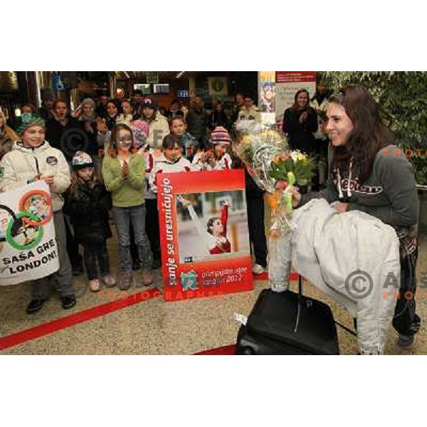 Slovenian gymnast Sasa Golob receives warm welcome from his friends and fans at Joze Pucnik Airport, Ljubljana, Slovenia on January 14, 2012 after success at Olympic qualification event for London 2012 Olympic games. She will be olympian for the first tim