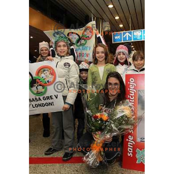 Slovenian gymnast Sasa Golob receives warm welcome from his friends and fans at Joze Pucnik Airport, Ljubljana, Slovenia on January 14, 2012 after success at Olympic qualification event for London 2012 Olympic games. She will be olympian for the first tim