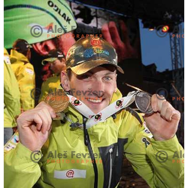 Jakov Fak of Slovenia with medals from World Biathlon Championships in Ruhpolding during reception for the fans at Congress Square in Ljubljana, Slovenia on March 12,2012 