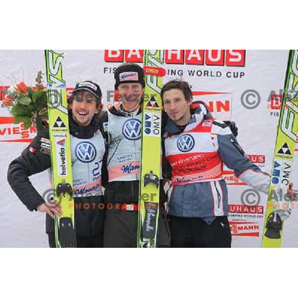 Simon Ammann , Martin Koch and Robert Kranjec during final competition of FIS World Cup Ski Jumping Planica in Planica, Slovenia on March 18, 2012 