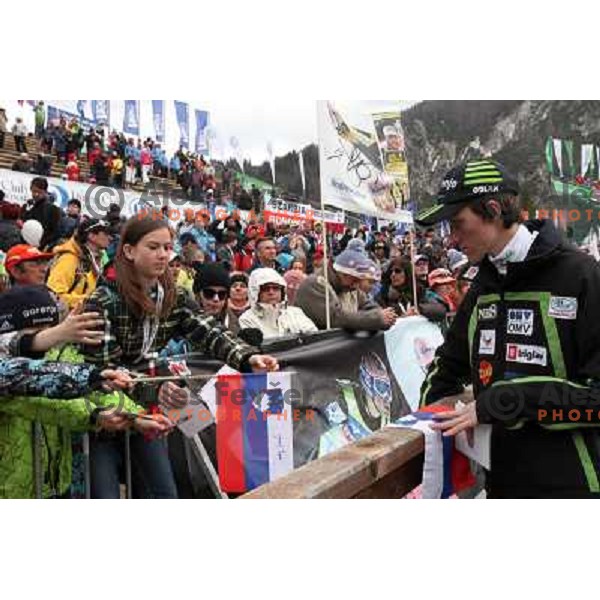 Peter Prevc of Slovenia with fans during final competition of FIS World Cup Ski Jumping season 2011-2012 in Planica, Slovenia on March 18, 2012 