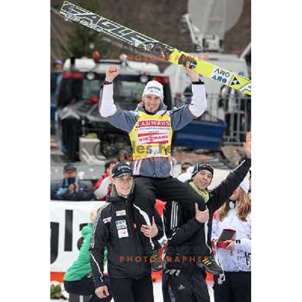 Robert Kranjec of Slovenia, overall champion with Jurij Tepes and Jure Sinkovec during final competition of FIS World Cup Ski Jumping Planica in Planica, Slovenia on March 18, 2012 
