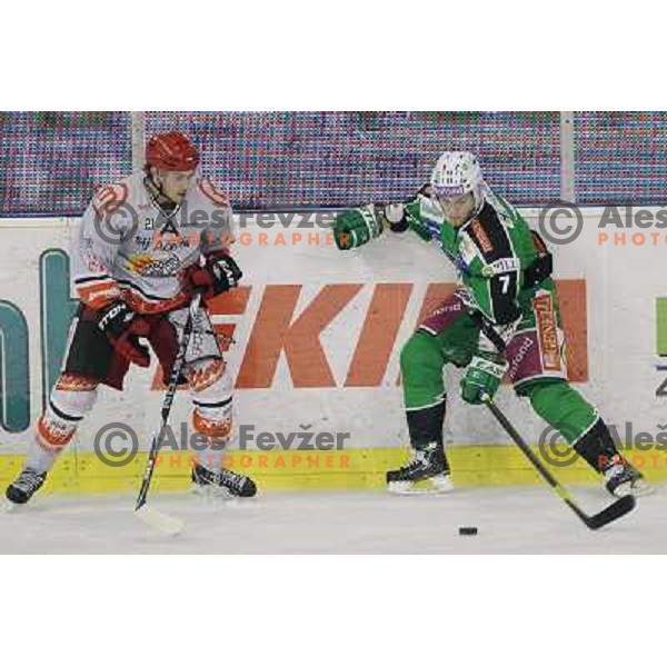 Domen Vedlin of Olimpija and Klemen Pretnar of Acroni Jesenice in action during first match of the Final of Slovenian ice-hocey Championships, played in Hala Tivoli, Ljubljana, Slovenia on March 26, 2012 