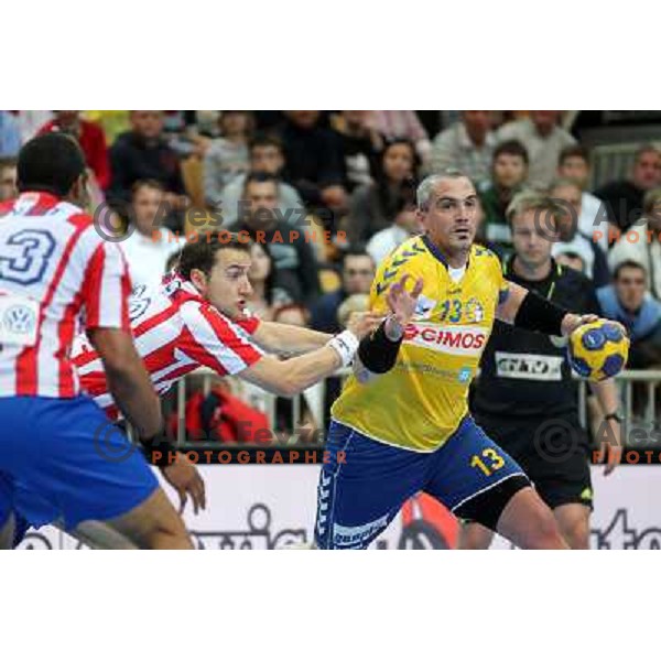 Milorad Krivokapic of Cimos Koper and Mariusz Jurkiewicz of Atletico Madrid during handball match RK Cimos Koper (Slovenia) and BM Atletico Madrid (Spain) in VELUX EHF Champions league 2011-2012, played in Bonifika Hall, Koper, Slovenia on April 22, 2012 