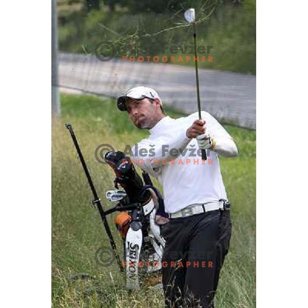 Pro Ales Gregoric playing out of the rough during sudden death to decide winner at Diners golf & country club championship in Smlednik, Slovenia on June 26, 2012 