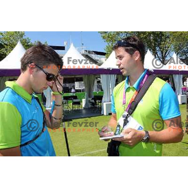 Klemen Strajhar and coach Matej Zupanc of Slovenia in action during practice session in archery at Lord\'s Cricket ground during London 2012 Summer Olympic games, Great Britain on July 25, 2012 
