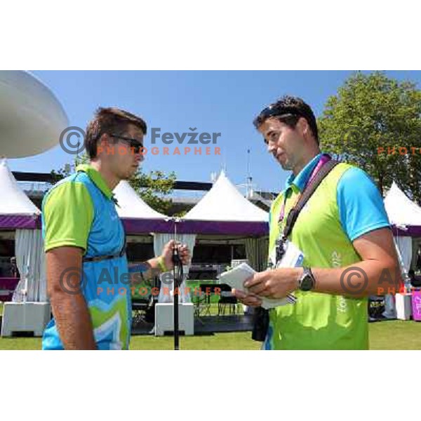 Klemen Strajhar and coach Matej Zupanc of Slovenia in action during practice session in archery at Lord\'s Cricket ground during London 2012 Summer Olympic games, Great Britain on July 25, 2012 