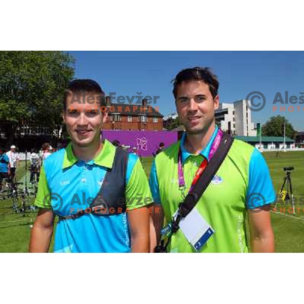 Klemen Strajhar and coach Matej Zupanc of Slovenia in action during practice session in archery at Lord\'s Cricket ground during London 2012 Summer Olympic games, Great Britain on July 25, 2012 
