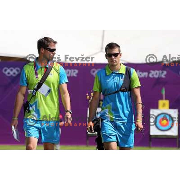 Klemen Strajhar and coach Matej Zupanc of Slovenia in action during practice session in archery at Lord\'s Cricket ground during London 2012 Summer Olympic games, Great Britain on July 25, 2012 