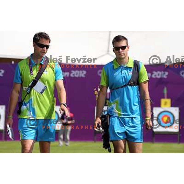 Klemen Strajhar and coach Matej Zupanc of Slovenia in action during practice session in archery at Lord\'s Cricket ground during London 2012 Summer Olympic games, Great Britain on July 25, 2012 
