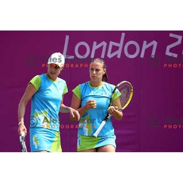 Katarina Srebotnik and Andreja Klepac of Slovenia in action during practice session at All England Lawn Tennis and Croquet Club in Wimbledon, London 2012 Summer Olympic games, Great Britain on July 25, 2012 