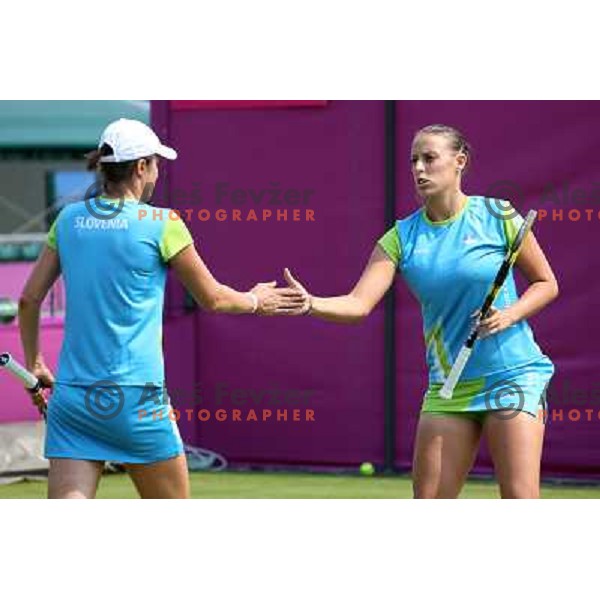 Katarina Srebotnik and Andreja Klepac of Slovenia in action during practice session at All England Lawn Tennis and Croquet Club in Wimbledon, London 2012 Summer Olympic games, Great Britain on July 25, 2012 