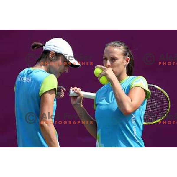 Katarina Srebotnik and Andreja Klepac of Slovenia in action during practice session at All England Lawn Tennis and Croquet Club in Wimbledon, London 2012 Summer Olympic games, Great Britain on July 25, 2012 