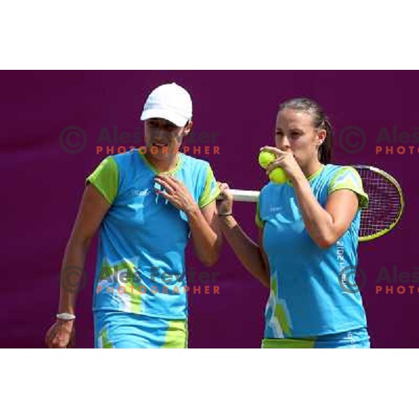 Katarina Srebotnik and Andreja Klepac of Slovenia in action during practice session at All England Lawn Tennis and Croquet Club in Wimbledon, London 2012 Summer Olympic games, Great Britain on July 25, 2012 