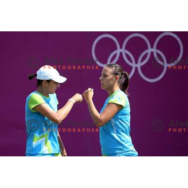 Katarina Srebotnik and Andreja Klepac of Slovenia in action during practice session at All England Lawn Tennis and Croquet Club in Wimbledon, London 2012 Summer Olympic games, Great Britain on July 25, 2012 