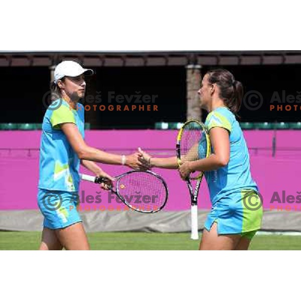 Katarina Srebotnik and Andreja Klepac of Slovenia in action during practice session at All England Lawn Tennis and Croquet Club in Wimbledon, London 2012 Summer Olympic games, Great Britain on July 25, 2012 