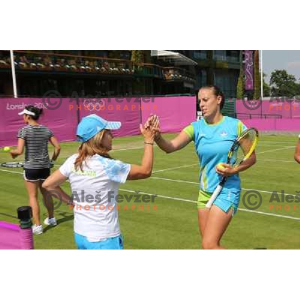 Mima Jausevec and Andreja Klepac of Slovenia during practice session at All England Lawn Tennis and Croquet Club in Wimbledon, London 2012 Summer Olympic games, Great Britain on July 25, 2012 